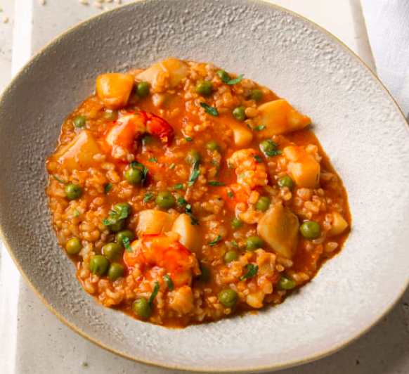 Arroz integral meloso con sepia y gambones